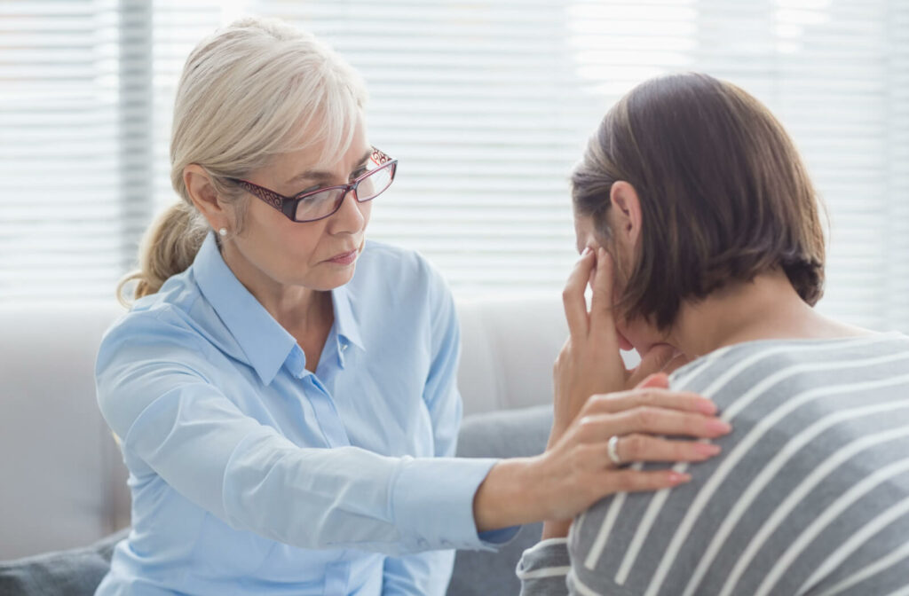 A woman is consulting a therapist regarding her situation having a parent with dementia and how to handle it.